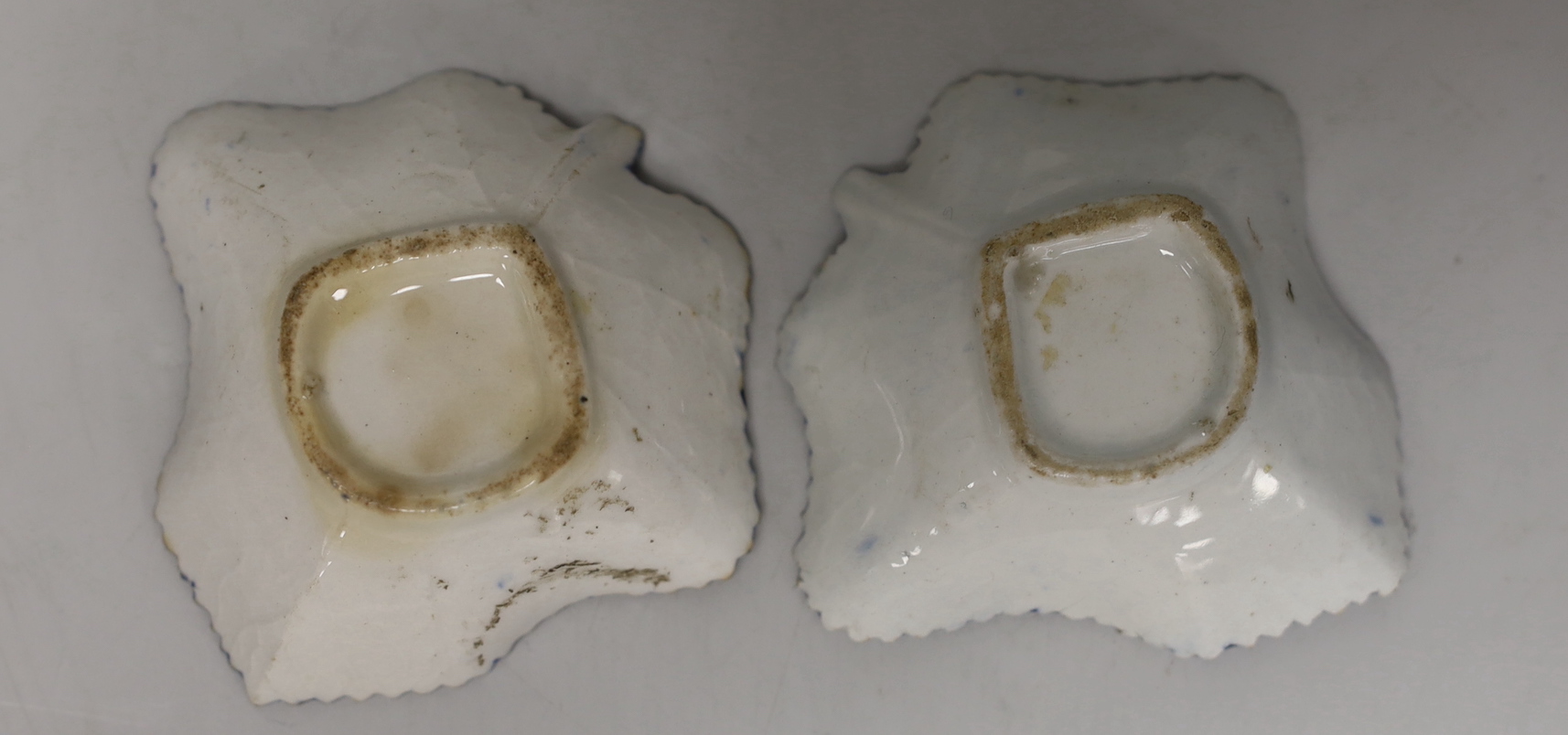 An 18th century Bow porcelain octagonal plate and two Bow pickle leaf dishes
